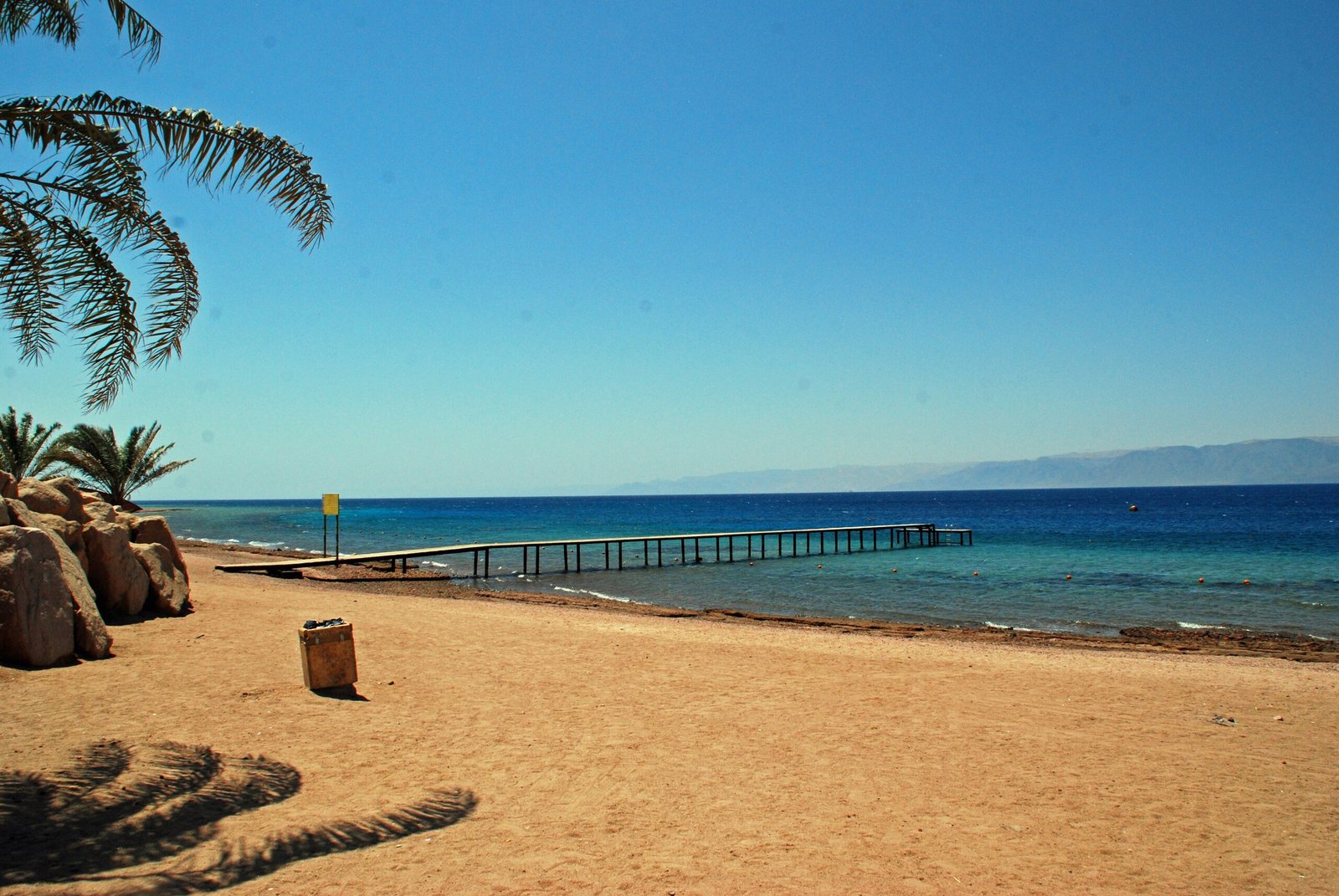 The shoreline of the Aqaba Marine Park in Jordan, with the Gulf of Aqaba beyond.