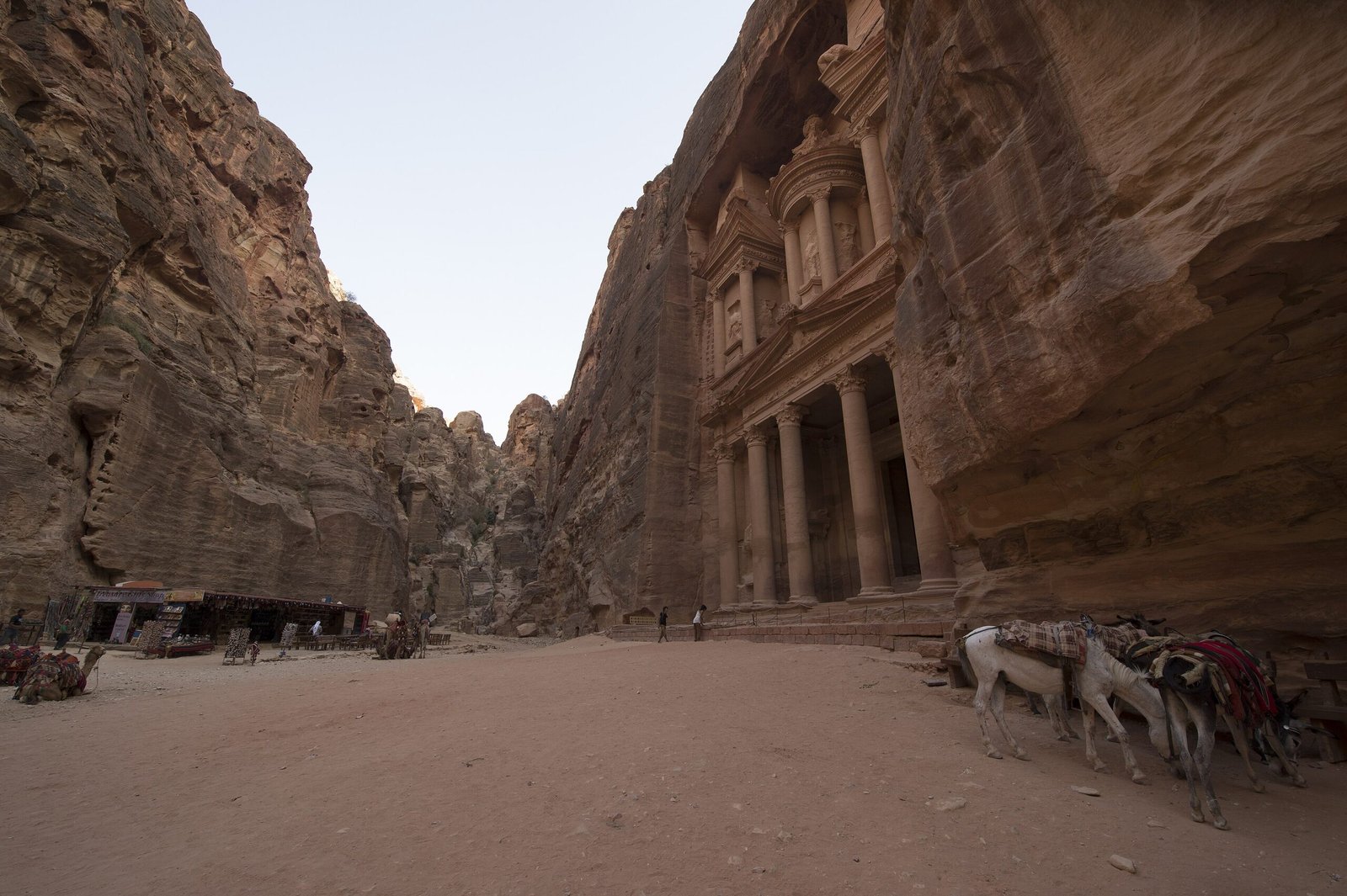 View of Al-Khazneh framed between the narrow sandstone walls of the Siq at Petra.